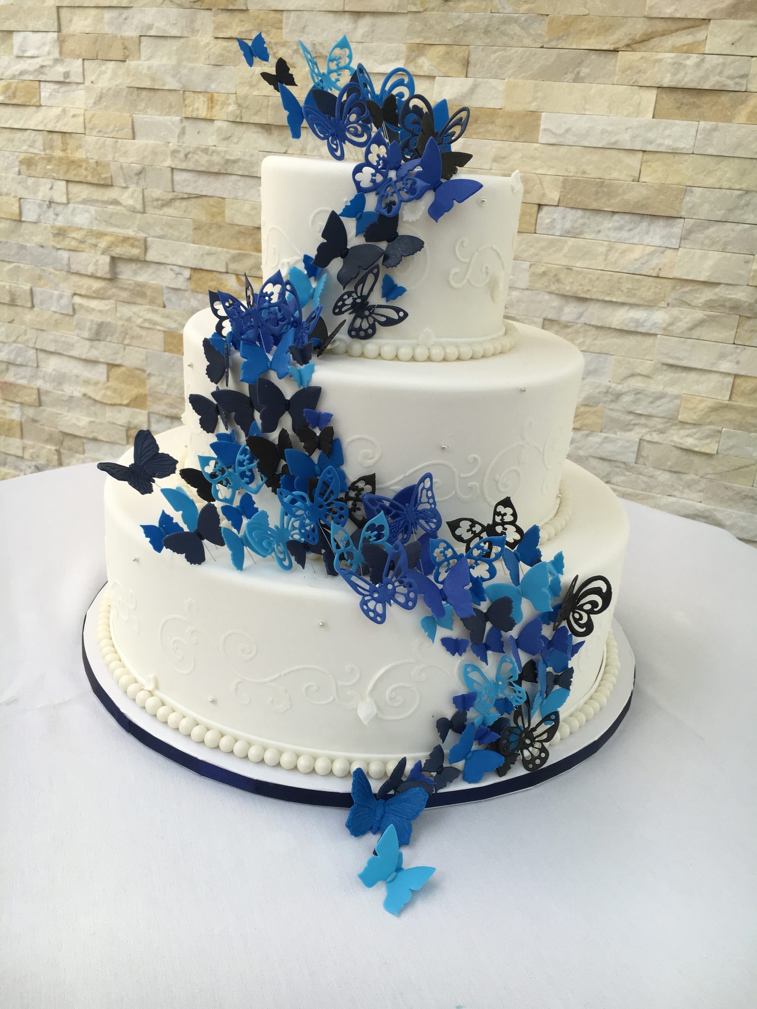 Wedding cake with cascading sugar butterflies